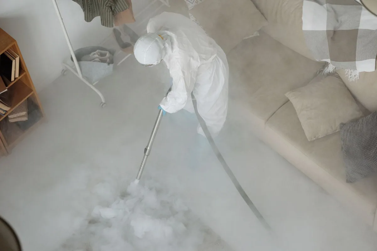 Biohazard cleanup technician in protective equipment, Negaunee, MI